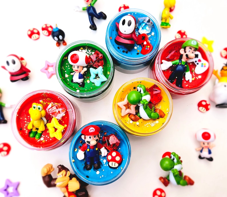homemade playdough jar with video game character figure and sensory pieces
