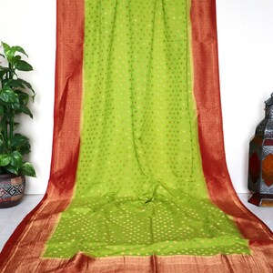 Beanarasi semi-georgette saree with Benarasi jari border, rich pallu, small jari buti all over the saree, blouse piece. Fall Pico included