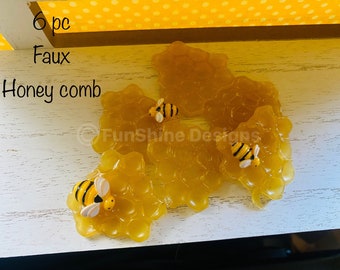 Faux honeycomb pieces with bees for decorative accents/filler