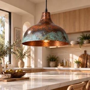 May include: A dome-shaped pendant light fixture featuring a weathered copper finish with prominent teal-colored oxidation patches. The interior of the wide metal shade is smooth and reflective, housing a single glowing light bulb at its center.