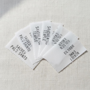 May include: A set of three ceramic mugs with a speckled, matte finish. The mugs are in shades of cream, light gray, and dark gray. Each mug has a simple, minimalist design, perfect for coffee or tea.