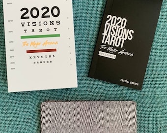 May include: A white and black guidebook for the 2020 Visions Tarot deck. The guidebook is titled "The Major Arcana" and features the text "2020 Visions Tarot" and "Krystal Banner".