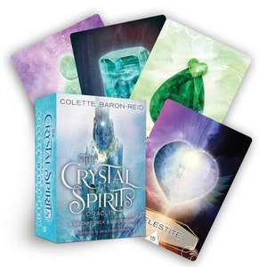 May include: The Crystal Spirits Oracle deck box features a blue background with a crystal image and the title "The Crystal Spirits Oracle". The box includes a 58-card deck and guidebook. The text "Illustrations by Jena DellaGrottagis" is printed on the bottom of the box.