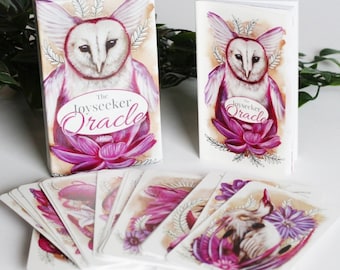 May include: A deck of oracle cards with a pink and white owl design. The box features the text "The Joyseeker Oracle".