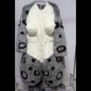 May include: A full-body costume resembling a snow leopard. The costume is primarily gray with black spots and a white chest and belly. The faux fur suit has a hood and attached feet, designed for cosplay or costume events.