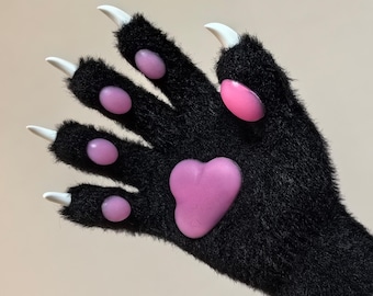 May include: Black furry paw gloves with pink paw pads and white claws.