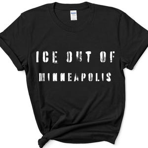 May include: Black t-shirt with the white text "ICE OUT OF MINNEAPOLIS" in a distressed font. The shirt is made of a soft material and has a classic crew neck design. The sleeves are rolled up.