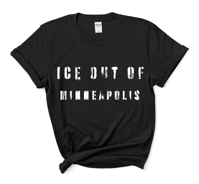 May include: Black t-shirt with the white text "ICE OUT OF MINNEAPOLIS" in a distressed font. The shirt is made of a soft material and has a classic crew neck design. The sleeves are rolled up.