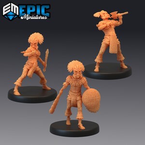 May include: Three unpainted plastic miniatures of warriors wearing feathered headdresses and ornate clothing. The figures are holding weapons and shields. The miniatures are on black bases.