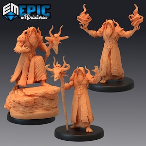 May include: Three 3D printed miniature figures of a humanoid figure with a long beard and horns, wearing a long robe and holding a staff. The figures are painted in a light brown color.