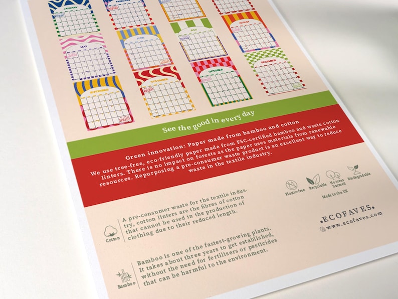 May include: A colorful calendar print with monthly calendar blocks in various patterns and colors. The print includes text about eco-friendly paper made from bamboo and cotton, with the words "See the good in every day."