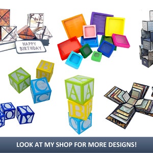 May include: Assortment of colorful papercraft boxes, including a stack of alphabet blocks, a stack of boxes with a "Happy Birthday" message, a stack of boxes with a geometric pattern, a stack of boxes with a floral pattern, and a stack of boxes with a map pattern.  The boxes are all made of paper and are decorated with various colors and patterns.