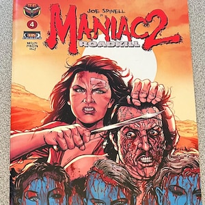May include: A comic book cover with a red background and a woman with red hair holding a knife to a man's head. The title of the comic is "Maniac 2: Roadkill".