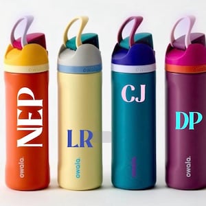 May include: Four colorful Owala water bottles. The bottles are orange, yellow, teal, and purple. Each bottle has a different colored lid and handle. The bottles have the initials NEP, LR, CJ, and DP printed on them.