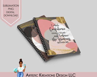 May include: Two gray spiral bound notebooks with pink and gold abstract designs. The front cover of one notebook has the text "I inhale Confidence Exhale Doubt and Embrace the Greatness WITHIN ME".