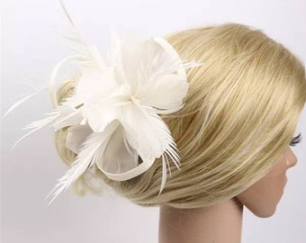 White flower fascinator clip with feather cocktail wedding ceremony bridesmaid bride