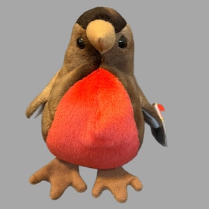 May include: A plush red-breasted robin bird toy with brown wings and a black head. The toy has a red breast and a small black beak.