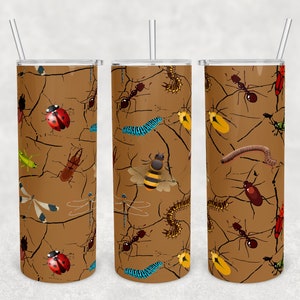 May include: Three brown insulated tumblers with a repeating pattern of insects like ladybirds, ants, and bees. The design has a cracked earth texture. Each tumbler has a silver straw. The tumblers are approximately 20 cm tall.