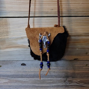 Genuine leather handmade bag with black sheep skin.