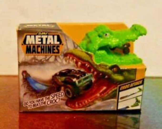 Toy Mini Brands - Metal Machines,Rubik's Cube,Dino Smashers,Rainbocorns,Fingerling Monkey,White Unicorn,Pink Unicorn,Jojo's Bow,TNT Mask/Leo