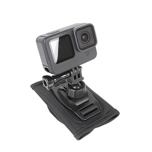 May include: A black action camera mounted on a black adjustable tripod with a black padded strap.