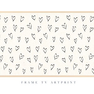 Pu&ograve; includere: Una stampa incorniciata con sfondo bianco e un motivo di cuori neri disegnati a mano.