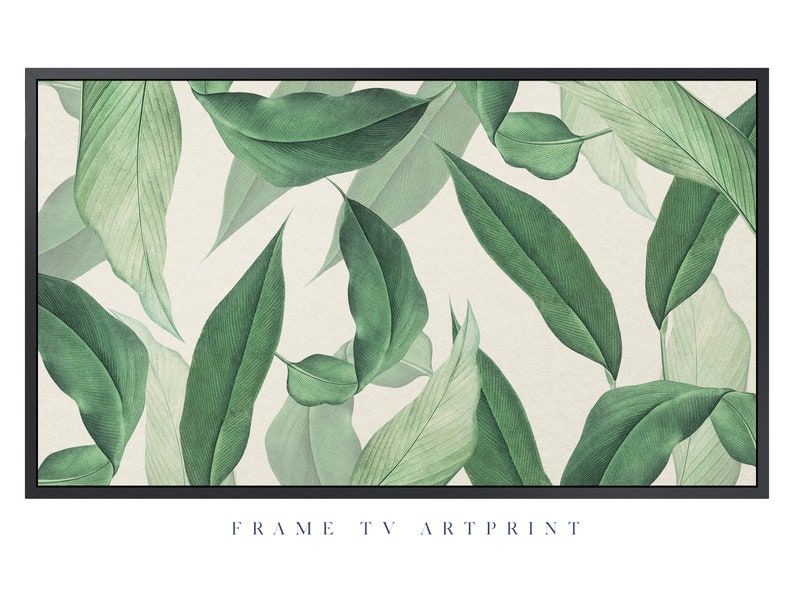 May include: A framed art print featuring a botanical illustration of green leaves on a cream background. The print has a black frame and the text "FRAME TV ART PRINT" at the bottom.