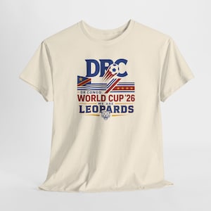 May include: A cream-colored short-sleeve t-shirt featuring a graphic with the text DPC, DR CONGO WORLD CUP '26, and WE ARE LEOPARDS. The design includes a soccer ball, the flag of the Democratic Republic of the Congo, four stars, and a leopard head.
