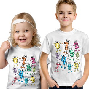 May include: Two children wearing white t-shirts with a colourful cartoon math design. The design features animated numbers 0-9 with arms and legs, along with math symbols. The children are smiling.
