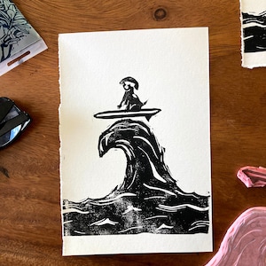 Pup surfing (black, sitting)- handmade linocut print