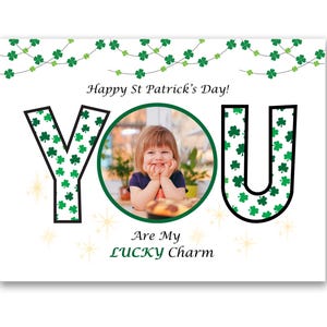 May include: A St. Patrick's Day greeting card with the word "YOU" in black outlined letters, the letters are filled with green shamrocks. A photo of a child is in the center. The text "Happy St. Patrick's Day!" and "Are My LUCKY Charm" are also on the card.