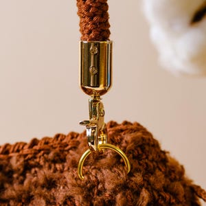 Brown Fluffy Crochet Drawstring Handbag With Crochet Bow Ties And Cute Little Pocket - Ideal For Winter And Special Events