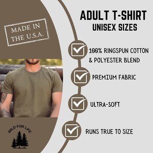 May include: A green t-shirt with the text "WILD FOR LIFE" and a pine tree graphic. The t-shirt is made of a 100% ringspun cotton and polyester blend. It is a unisex size and runs true to size. The t-shirt is made in the USA.