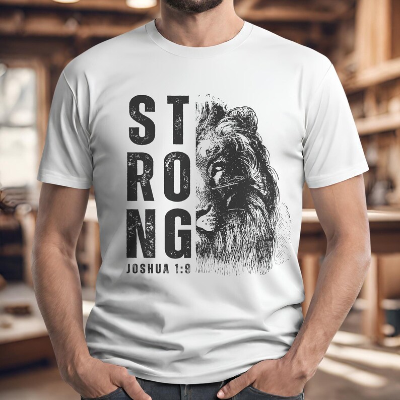 May include: White t-shirt with a black and white lion graphic and the text "STRONG" and "JOSHUA 1:9".