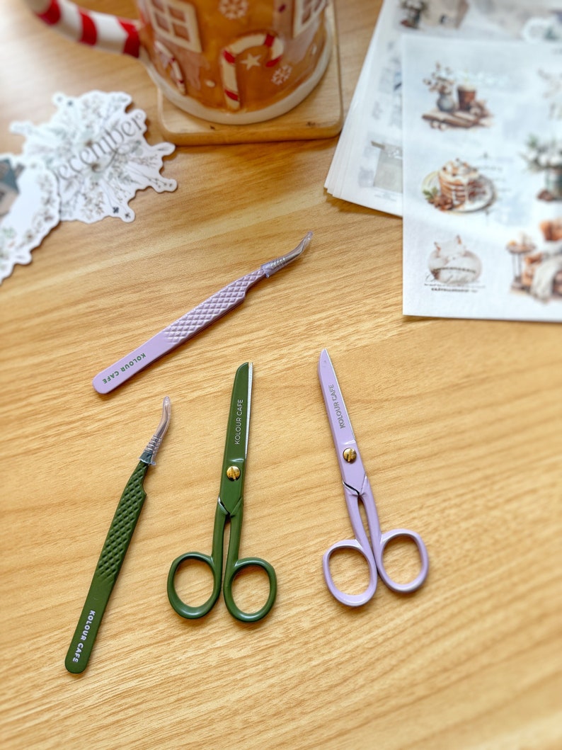 May include: Three pairs of tweezers, two are green and one is purple. The tweezers are on a wooden surface. The tweezers are labeled "KOLOUR CARE".