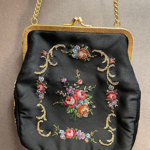 Small vintage embroidered fabric bag on a chain