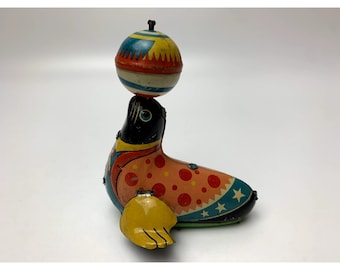 Vintage Japan Tin inertia Toy Rolling Seal Spinning Ball 8x10cm
