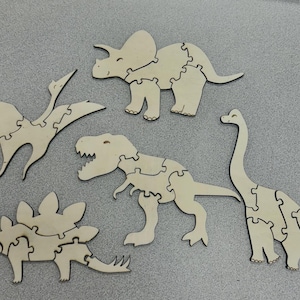 Rompecabezas de dinosaurios de madera cortados con láser / Dinosaurios / Unisex / Juguetes / Montessori / Ideales para viajes / Motricidad fina / Regalo para amantes de los dinosaurios / Sostenible
