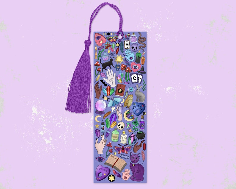 May include: A purple bookmark with a matching tassel. The bookmark is covered in colorful illustrations of mystical items, including a black cat, crystals, a Ouija board, and a spell book. The bookmark is designed for book lovers and those interested in the occult.