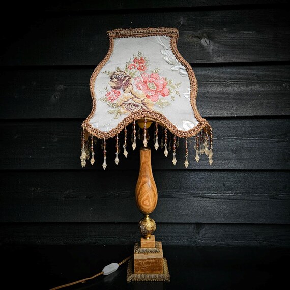 Onyx table lamp with brass decorations and Victorian lampshade with flowers and beaded fringes