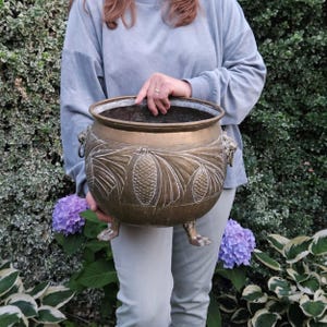 Large brass footed planter with embossed pineapple, lion heads handles and lion paws legs, Solid Brass gold cachepot Art Deco style