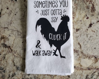 May include: White kitchen towel with a black silhouette of a rooster and the text "Sometimes you just gotta say cluck it & walk away".