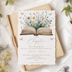 May include: Baby shower invitation with a watercolor illustration of an open book with flowers and butterflies. The invitation reads "A New Chapter Will Soon Begin" and includes event details and the name Amelia Harris.