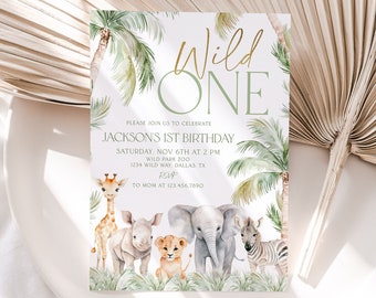May include: A white invitation with green palm trees and jungle animals. The text reads "Wild One" and includes details for Jackson's 1st birthday party.