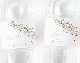 May include: Two clear plastic water bottles with white labels featuring a floral design and the text "Amelia's Bridal Shower".