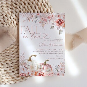 May include: Fall in love bridal shower invitation with a watercolor floral design featuring pumpkins and roses in shades of pink and peach. The invitation includes the text "Fall in love" and "Olivia Robinson".