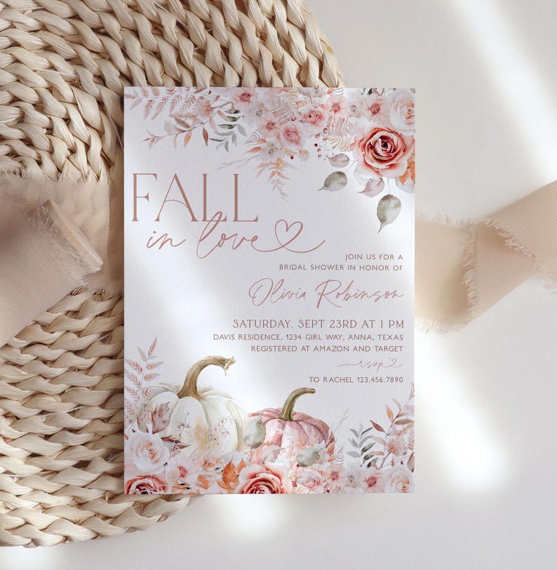 May include: Fall in love bridal shower invitation with a watercolor floral design featuring pumpkins and roses in shades of pink and peach. The invitation includes the text "Fall in love" and "Olivia Robinson".