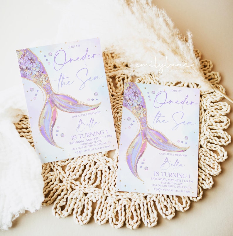 May include: Two purple and gold mermaid tail themed first birthday party invitations with the text "Oneder the Sea" and "Our Little Mermaid Bella is Turning 1".