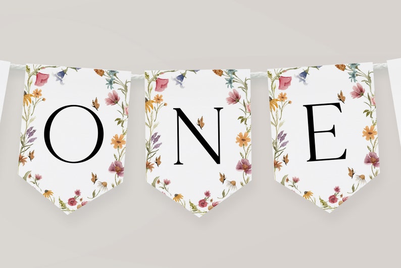 K&ouml;nnte beinhalten: Ein wei&szlig;es Banner mit einem Blumenmuster und dem Wort "ONE" in schwarzen Buchstaben. Das Banner ist perfekt f&uuml;r eine erste Geburtstagsfeier.