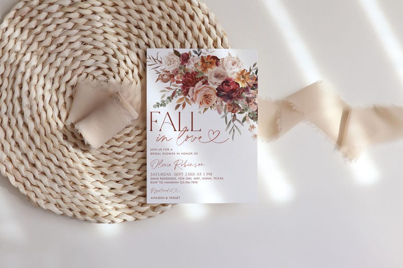 May include: Fall in love bridal shower invitation with a watercolor floral design in shades of pink, red, and orange. The invitation features the text "Fall in love" in a bold, red font. The invitation also includes the date, time, and location of the shower.